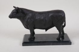 A filled bronze of a bull, on a marble base, 10" long