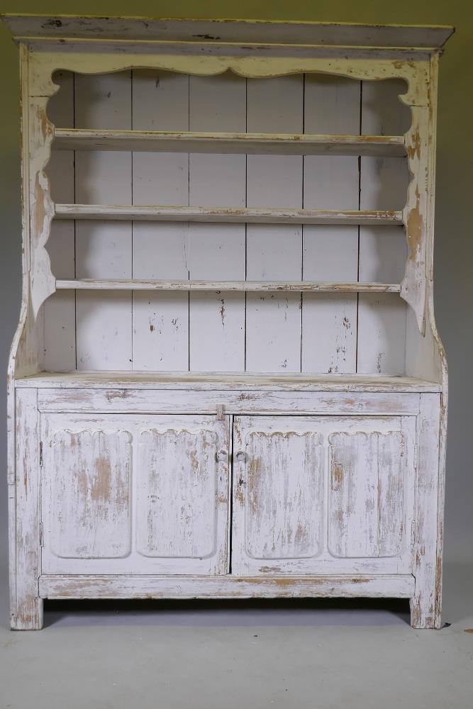 A C19th Irish painted pine dresser with closed rack over two cupboards, with decorative panelled - Image 2 of 3