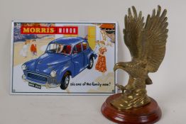 A brass eagle car mascot on a wood base, 9½" high, and a small Morris Minor enamel sign, 10" x 7"
