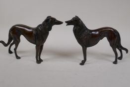 A pair of bronze figures of hounds, 6½" high