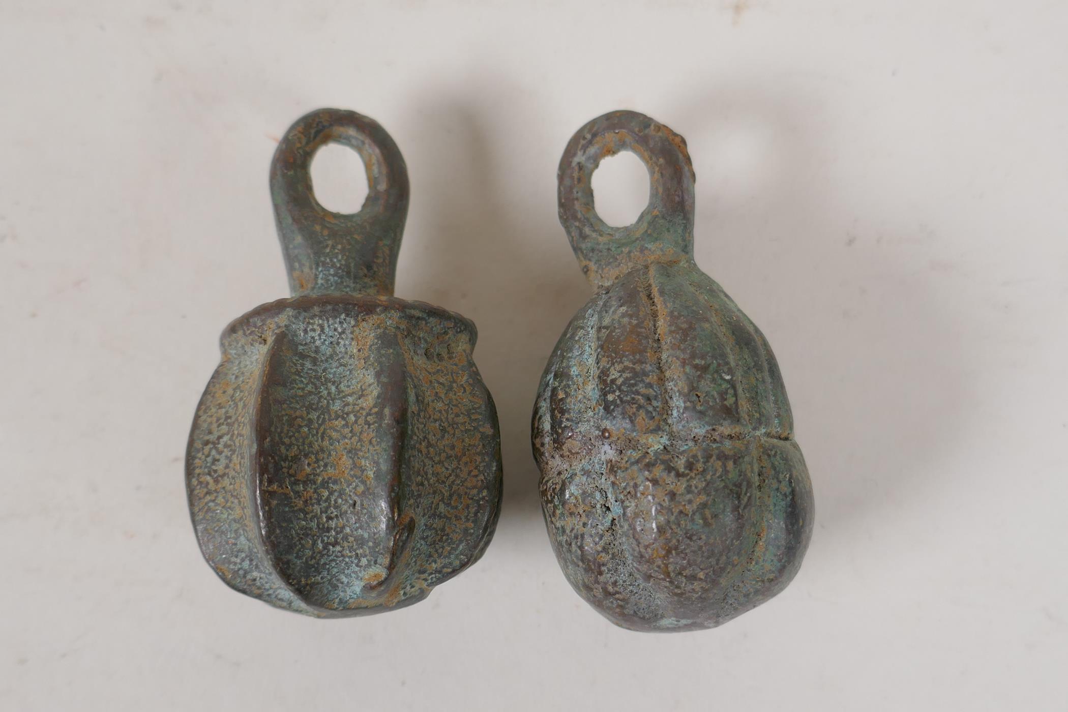 A pair of Chinese bronze scroll weights in the form of gourds, 2½" long - Image 2 of 2