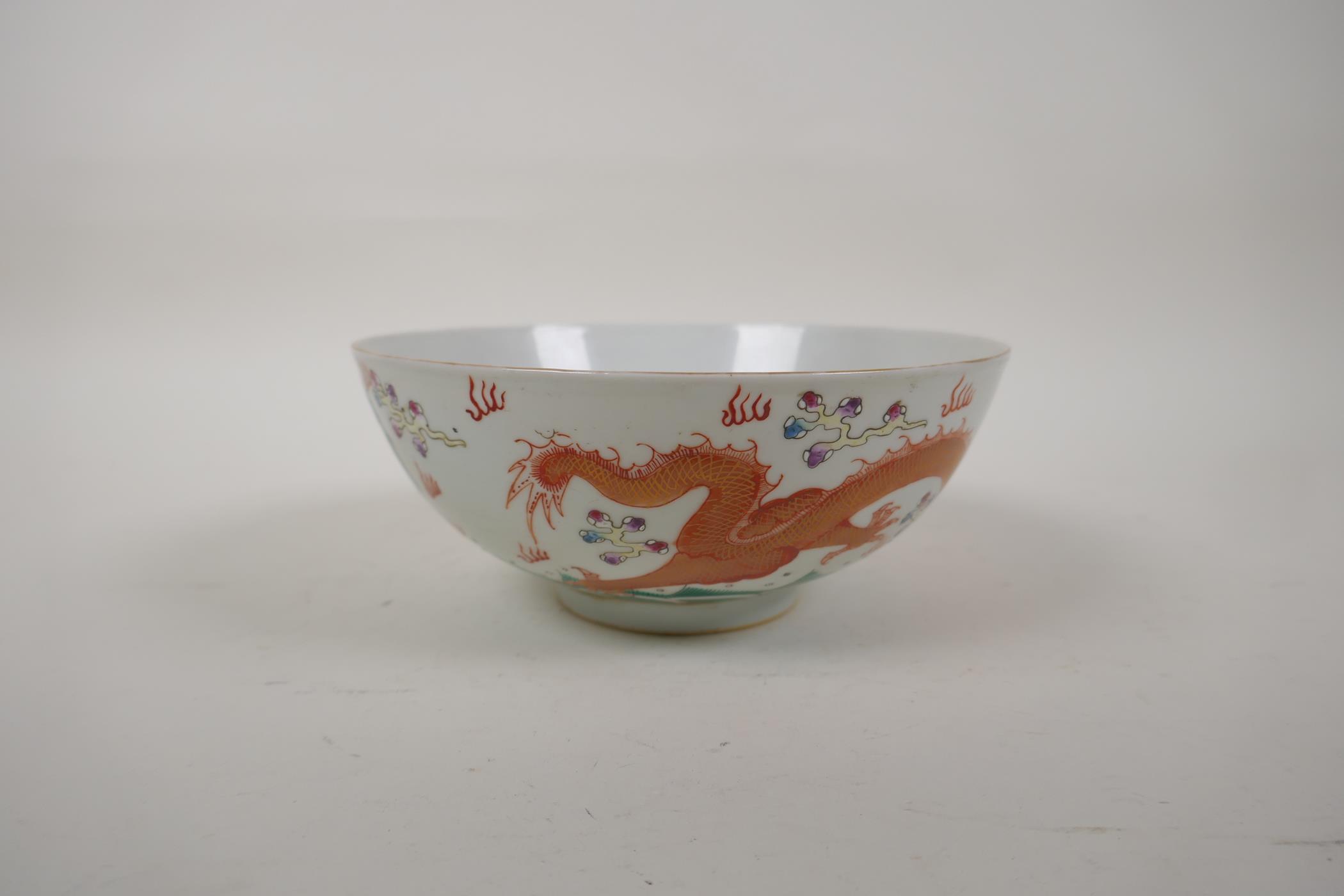 A polychrome porcelain bowl decorated with an iron red and green dragon chasing the flaming pearl, - Image 6 of 14