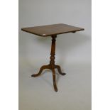 A Georgian mahogany tilt top tea table on turned column and tripod supports, 17" x 29" x 28" high