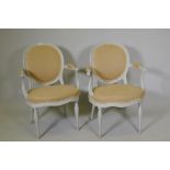 A pair of late C18th/early C19th open arm chairs, later painted, one labelled Lady Robertson, Oast