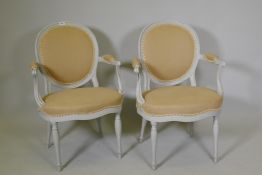 A pair of late C18th/early C19th open arm chairs, later painted, one labelled Lady Robertson, Oast