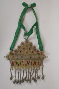A Turkman mixed metal necklace with bell drops and set with fabric panels and semi precious stones