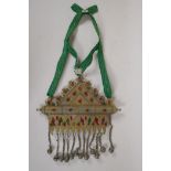 A Turkman mixed metal necklace with bell drops and set with fabric panels and semi precious stones