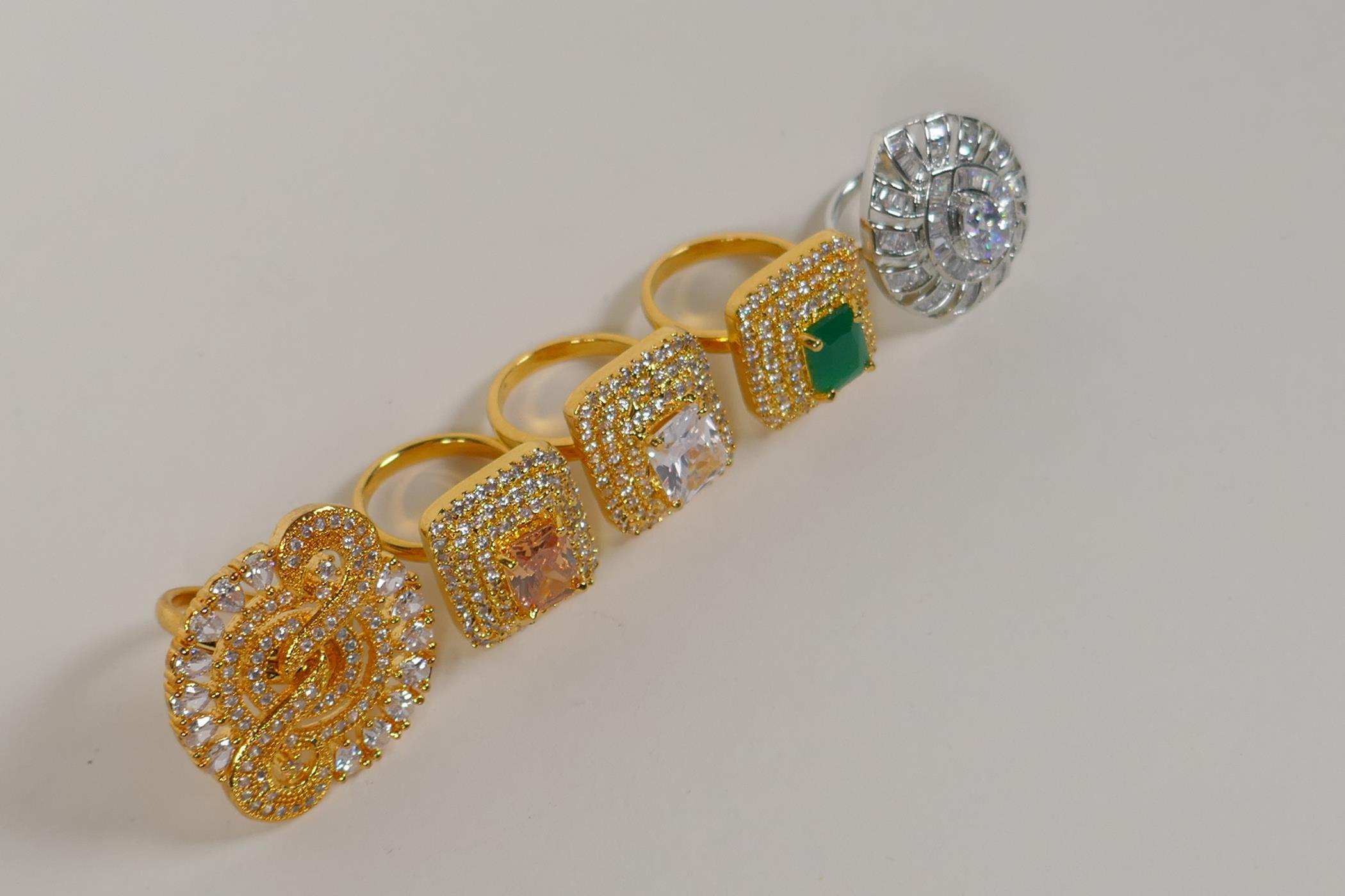 Four Indian gilt metal dress rings set with semi precious stones, and a similar silvered metal dress - Image 8 of 8