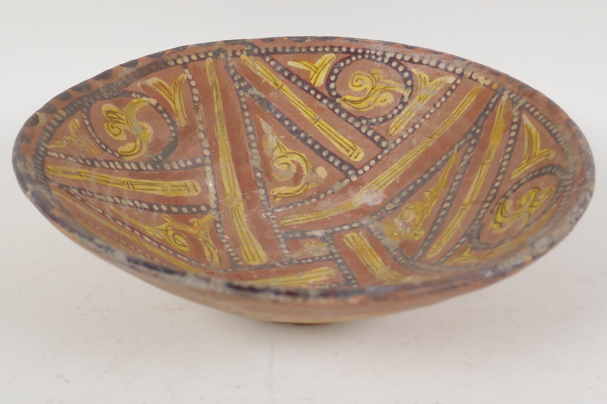 A Moorish earthenware bowl painted with geometric designs, 9" diameter - Image 2 of 3