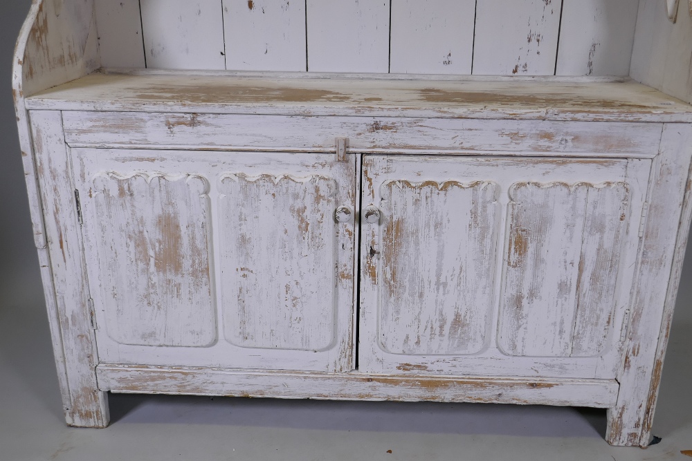A C19th Irish painted pine dresser with closed rack over two cupboards, with decorative panelled - Image 3 of 3