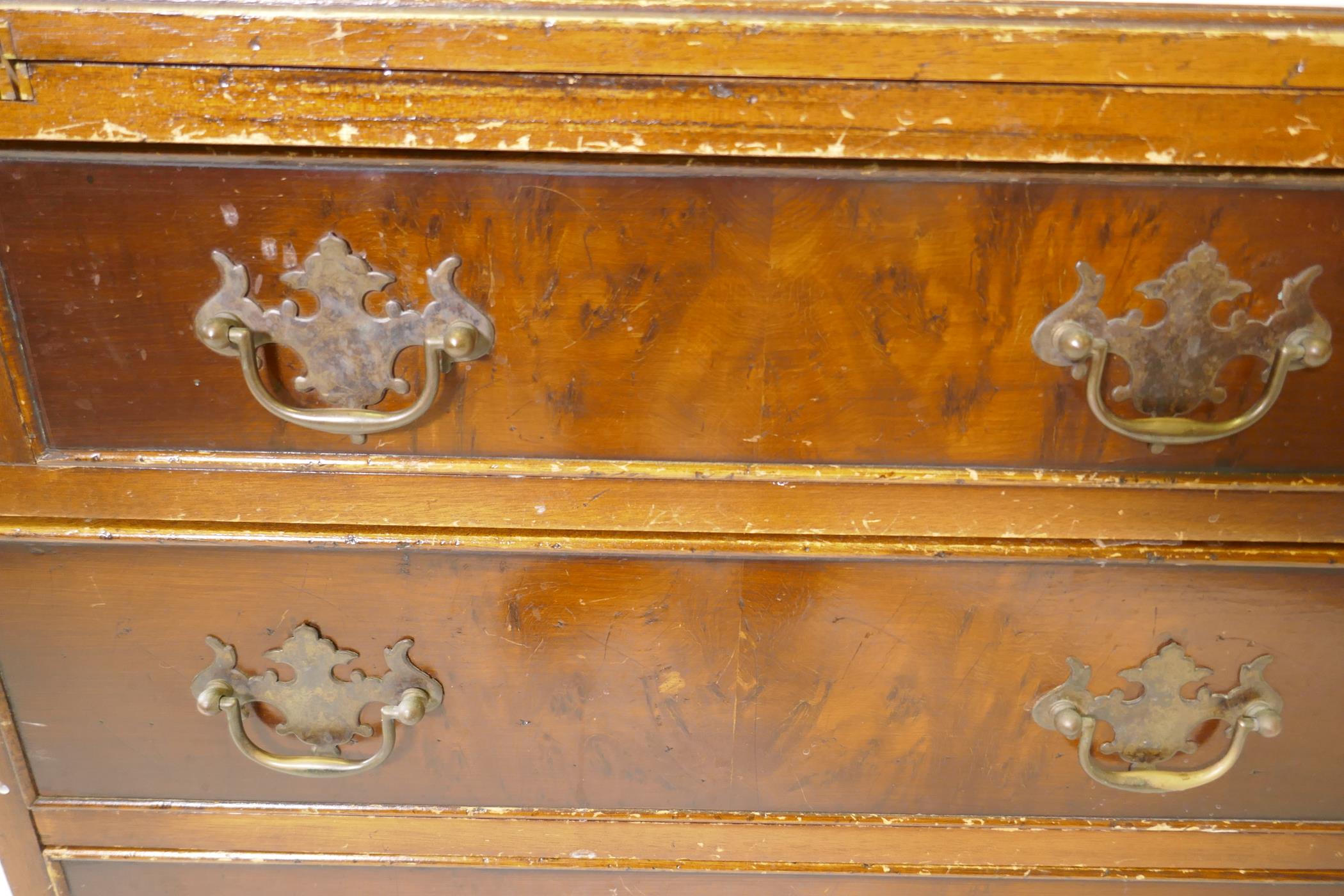 A yew wood veneered bachelor's chest, with fold out top over four drawers, raised on bracket - Image 7 of 7