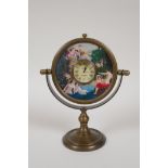 A brass desk clock/desk mirror decorated with classical female nudes, 7½" high