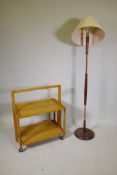 A 1970s teak and copper standard lamp, and a Haxyes beech folding hostess trolley, lamp 59" high