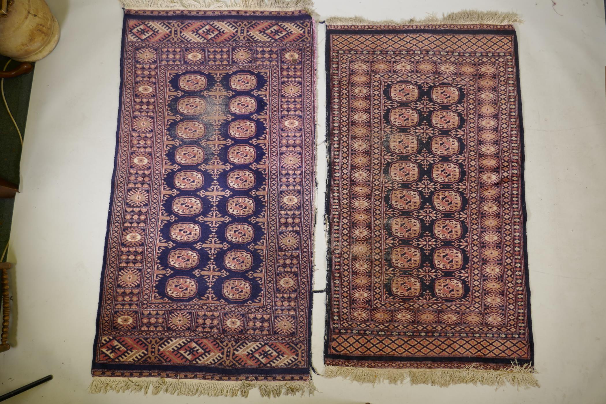 A Turkish blue ground Bokhara rug, a similar black ground Bokhara rug and two others, largest 68" - Image 2 of 12