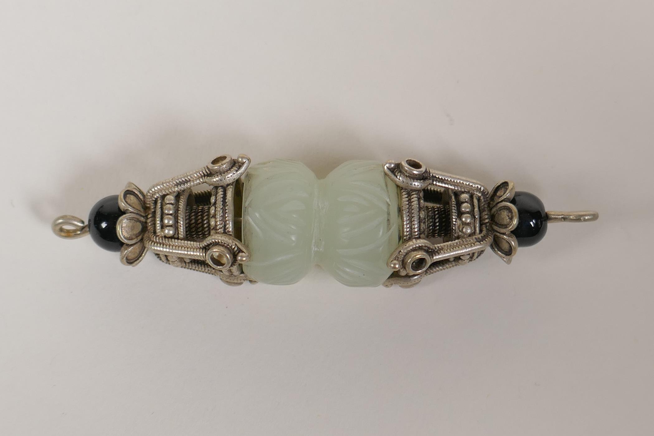 A Tibetan white metal and jade vajra style pendant and a Chinee carved hardstone pendant with dragon - Image 3 of 3