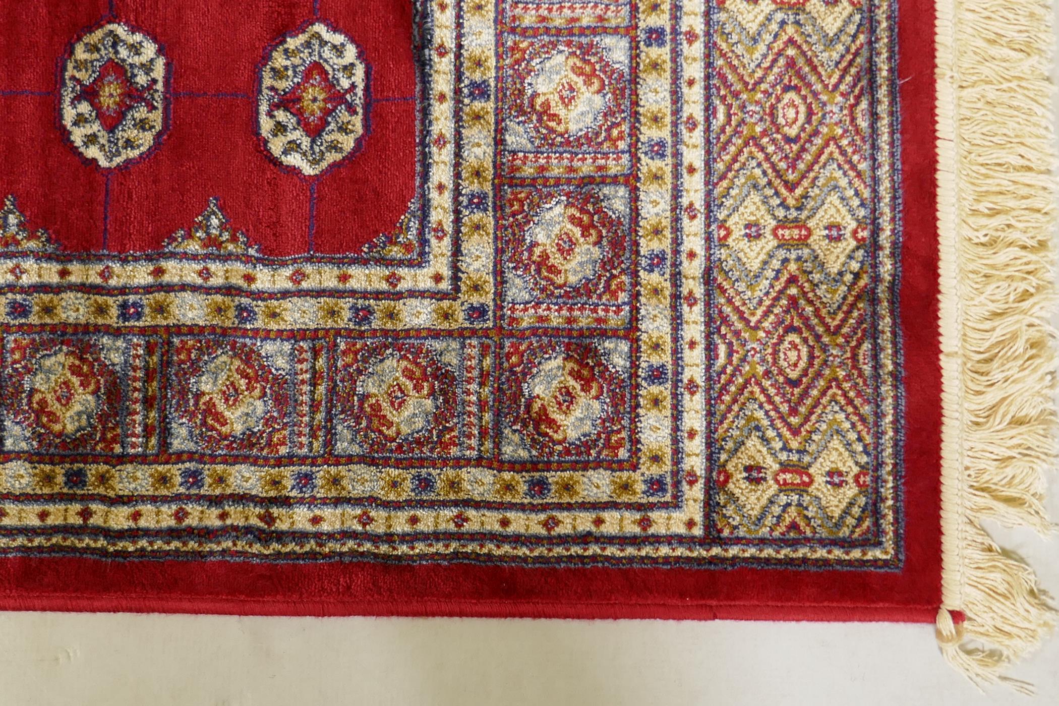 A rich red ground Kashmir rug with a Bokhara design, 47" x 69" - Image 5 of 6
