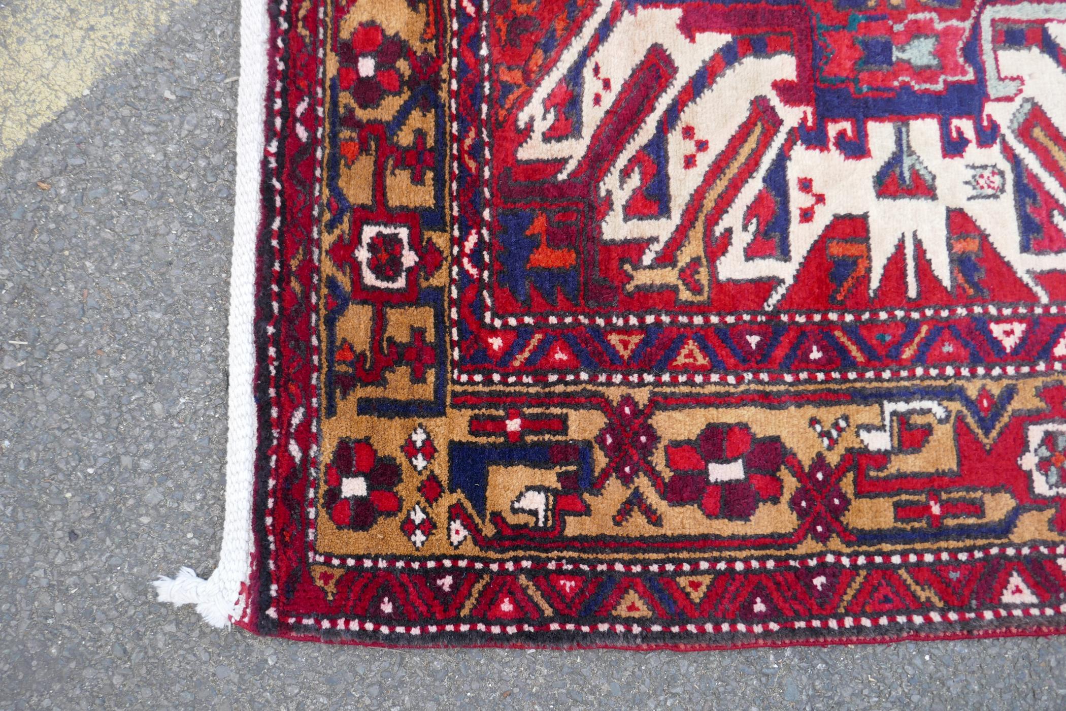 A Persian red ground Heritz runner with a starburst medallion design, 46" x 131" - Image 6 of 8
