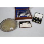 A set of six cased hallmarked silver coffee bean spoons, a cased set of silver plated knives and