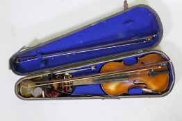 An antique violin in wood case, with two bows, one marked W. Dollenz, Leipzig, the other Tourte,