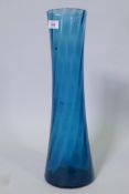 A slender blue glass vase, fault to base, 19" high