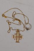 A 14ct gold 'Jerusalem' crucifix, 3.6g, and a 9ct gold stone set ring, 0.9g, on an 18ct gold