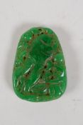 A Chinese apple jade pendant with carved monkey and gourd decoration, 1½" x 2"
