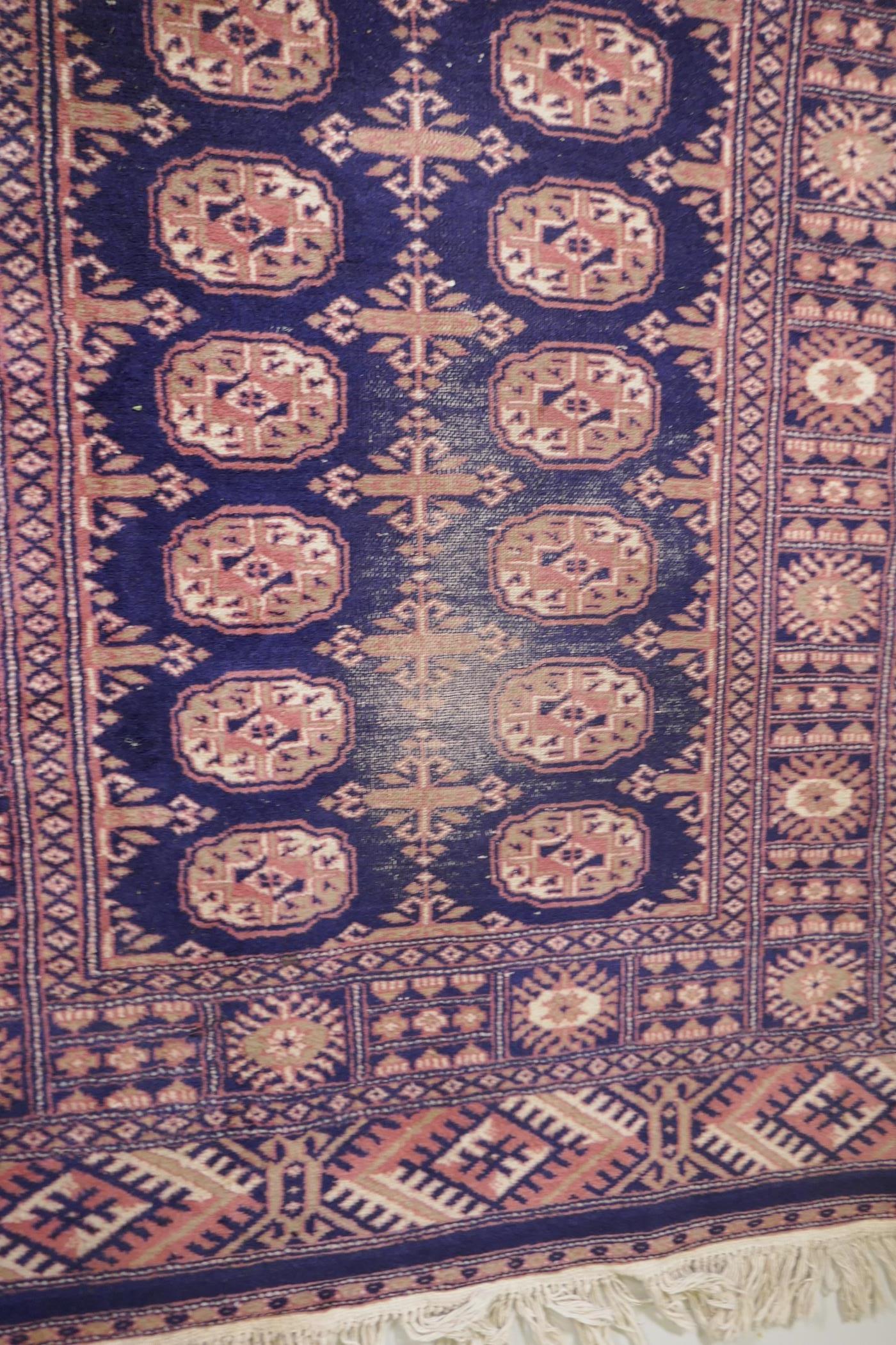 A Turkish blue ground Bokhara rug, a similar black ground Bokhara rug and two others, largest 68" - Image 5 of 12