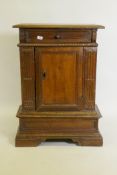 A late C18th/early C19th Italian carved walnut credenza with frieze drawer and single panel door, on