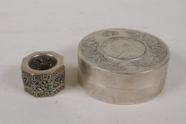 A Chinese white metal trinket box with coin decoration, and a Chinese white metal archers thumb