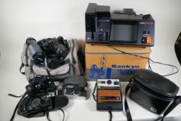 A quantity of cameras and photographic equipment including a Cosina CT4 SLR camera with Sunagor Auto