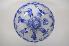 A Chinese Republic blue and white porcelain punch bowl decorated with boys at various pursuits,