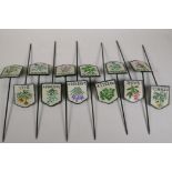 A set of twelve painted cast iron herb markers, 3" x 2½", stakes 8½" long