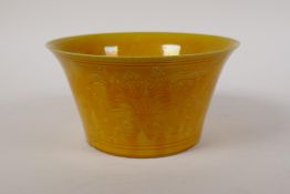 A yellow glazed porcelain bowl with incised waterfowl and lotus pond decoration, Chinese Hongzhi
