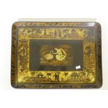 A C19th lacquered papier mache tray, the gilt border with chinoiserie decoration and central