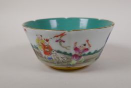 A famille rose porcelain rice bowl with a lobed rim, decoration with children playing in a