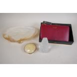 A boxed Osprey leather purse (new with tags), a shell dish, shell trinket box and a glass head