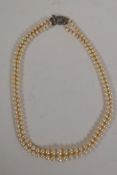 A vintage two strand pearl necklace with silver and marcasite clasp