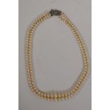 A vintage two strand pearl necklace with silver and marcasite clasp