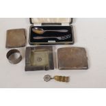 Two hallmarked silver cigarette boxes, a masonic ash tray and medal, a napkin ring, and