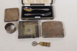 Two hallmarked silver cigarette boxes, a masonic ash tray and medal, a napkin ring, and