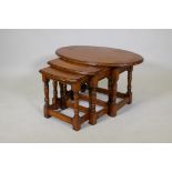 A nest of three beechwood shaped top occasional tables, 32" x 20" x 18"