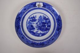 An C18th/C19th Chinese export ware porcelain plate decorated with variation on the Willow pattern,