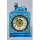 A Burmantofts Faience mantel clock with kylin top, impressed to base, 9" high, chip to base