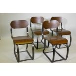 A set of four industrial style steel and bent plywood chairs