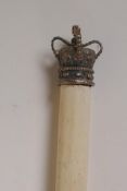 A ceremonial staff with silver crown finial and hallmarked silver tip, 69" long