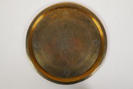 An Indo Persian brass serving tray decorated with cats, fish and birds, 12" diameter