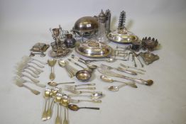 A quantity of silver plate, a pair of tureens and covers, a serving dish, claret jug with etched