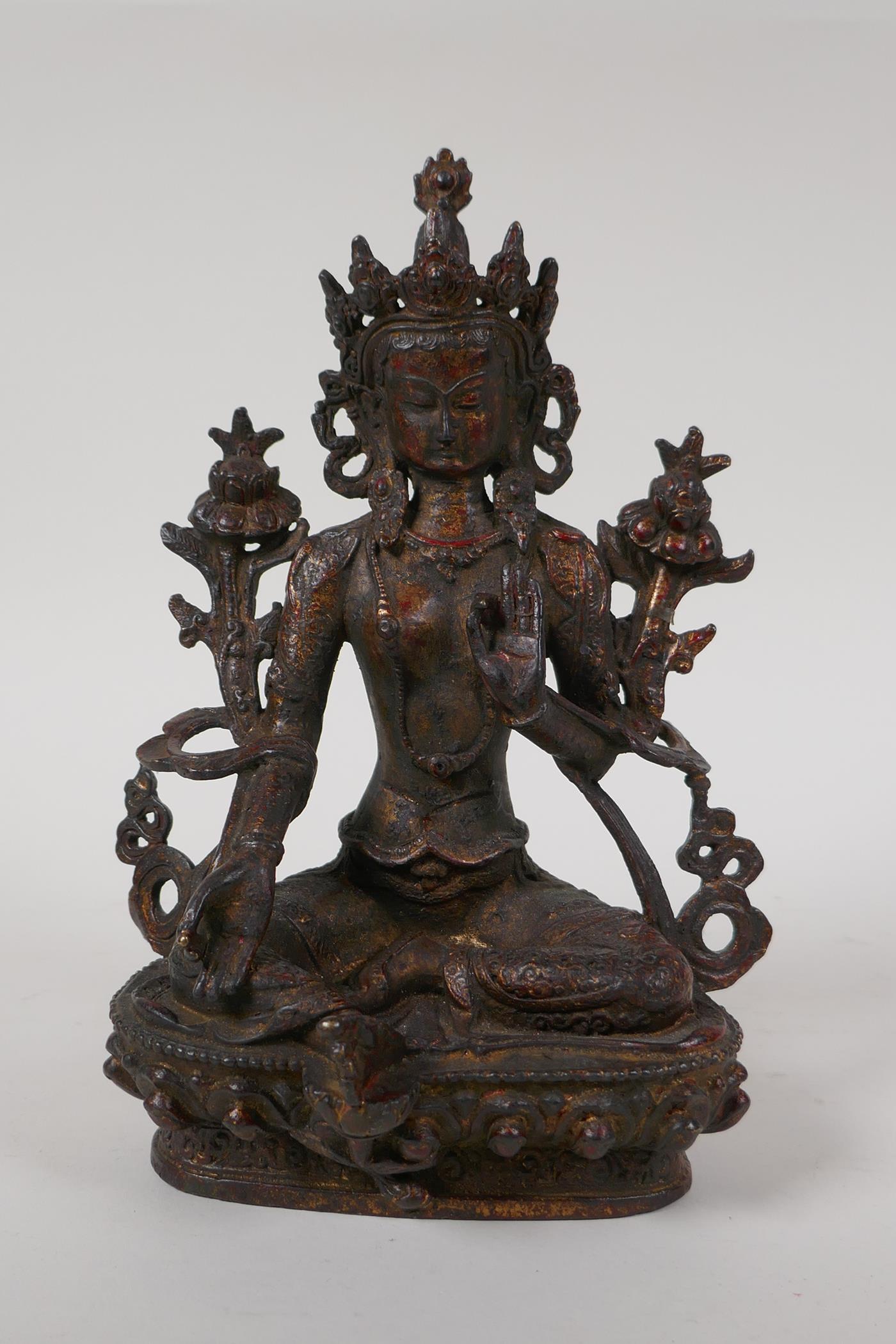 A Sino Tibetan bronze figure of Buddha seated on a lotus throne, with the remnants of gilt patina, - Image 2 of 6