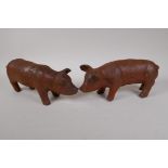 A pair of cast iron garden piglets, 12" long