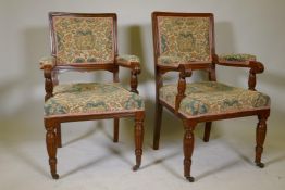 A pair of Victorian oak open armchairs with tapestry seats and seat backs, stamped A. Cribb & Sons